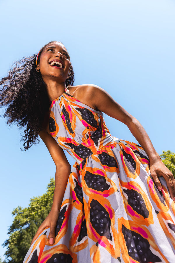 Woman in Papaya dress.